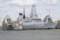 HMS DEFENDER passes through the Thames Barrier