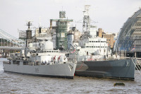 HMS Exeter berths alongside HMS Belfast London